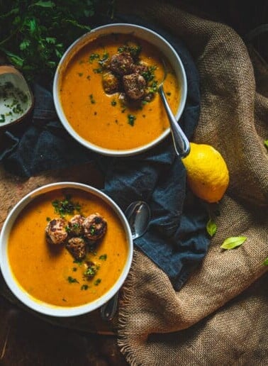 Ginger turkey meatballs in a creamy roasted carrot soup