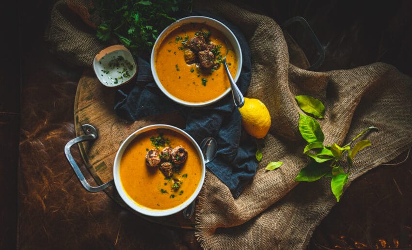 Ginger turkey meatballs in a creamy roasted carrot soup