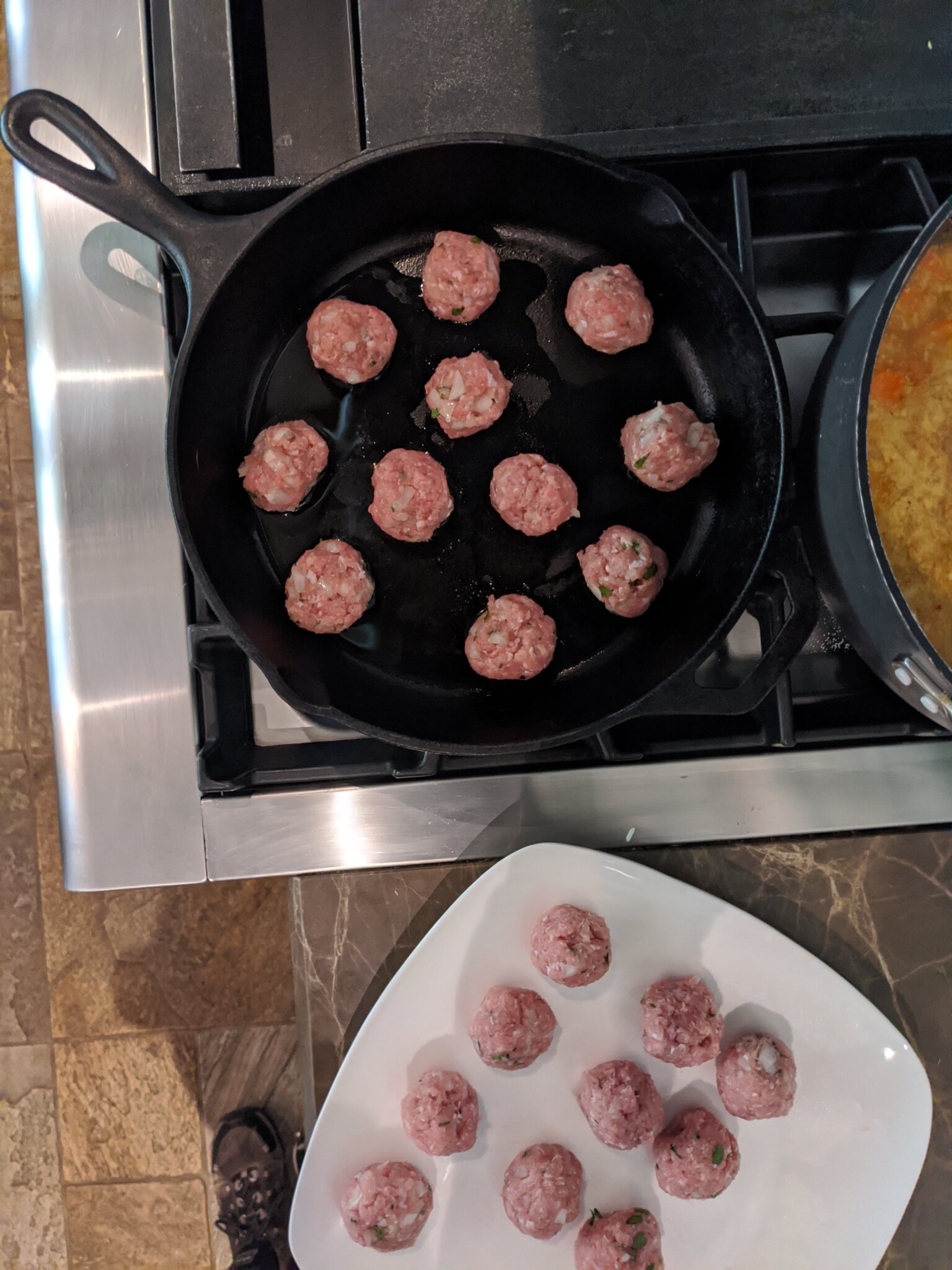 turkey meatballs with ginger being pan seared in cast iron