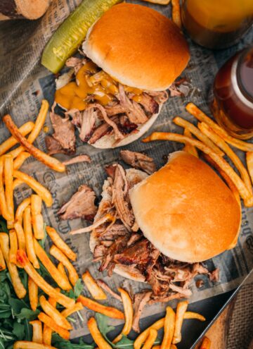Smoked Pulled Pork Sandwiches from the top on a platter with fries