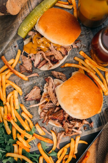Smoked Pulled Pork Sandwiches from the top on a platter with fries