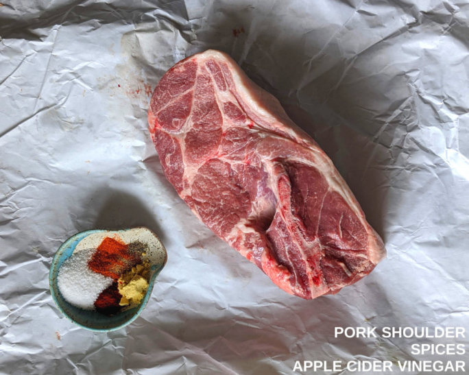 Pork shoulder - what you need for this Carolina smoked pork - with a small bowl of spices ready to rub down
