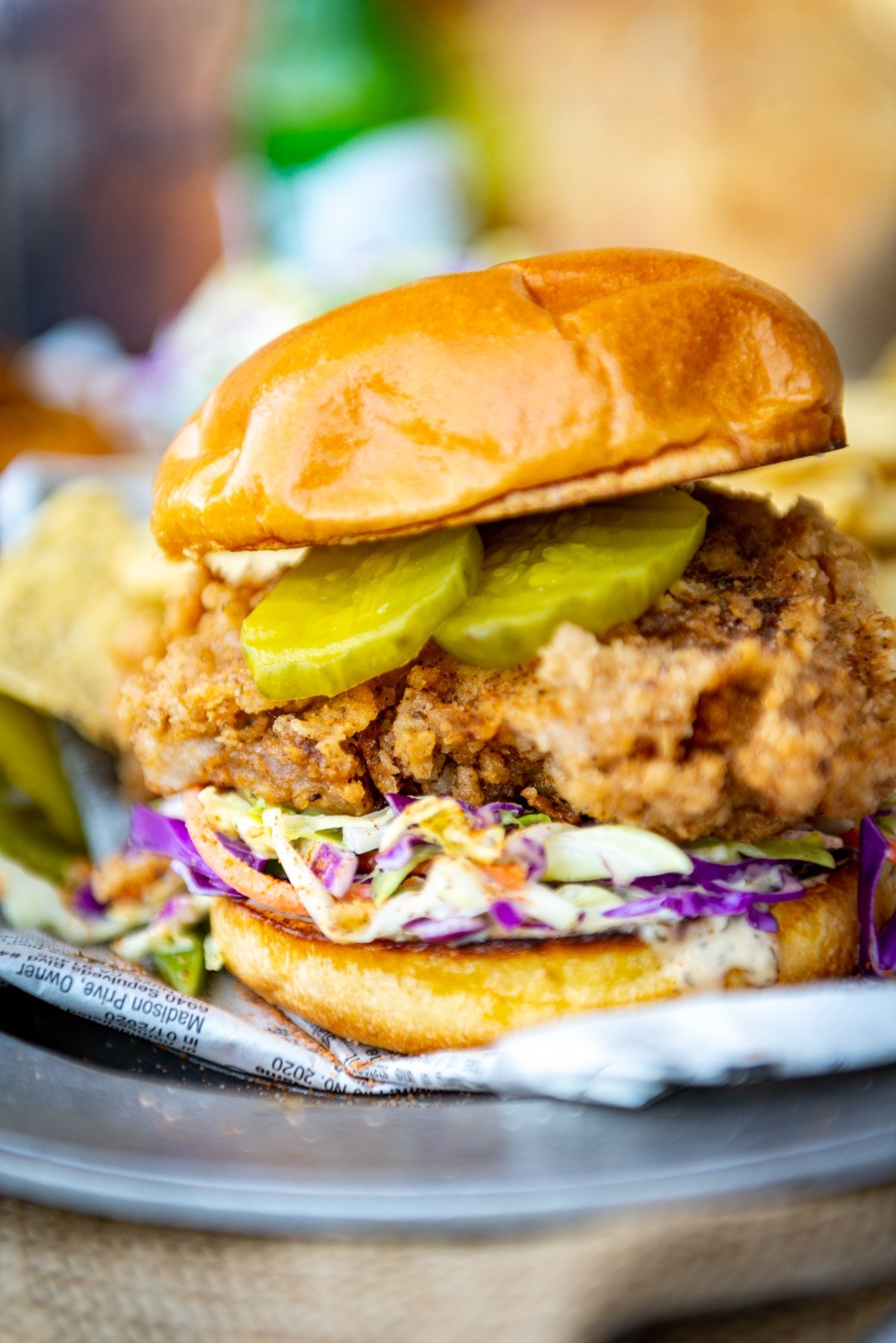 crispy fried chicken sandwich with ranch slaw and pickles waiting to be devoured