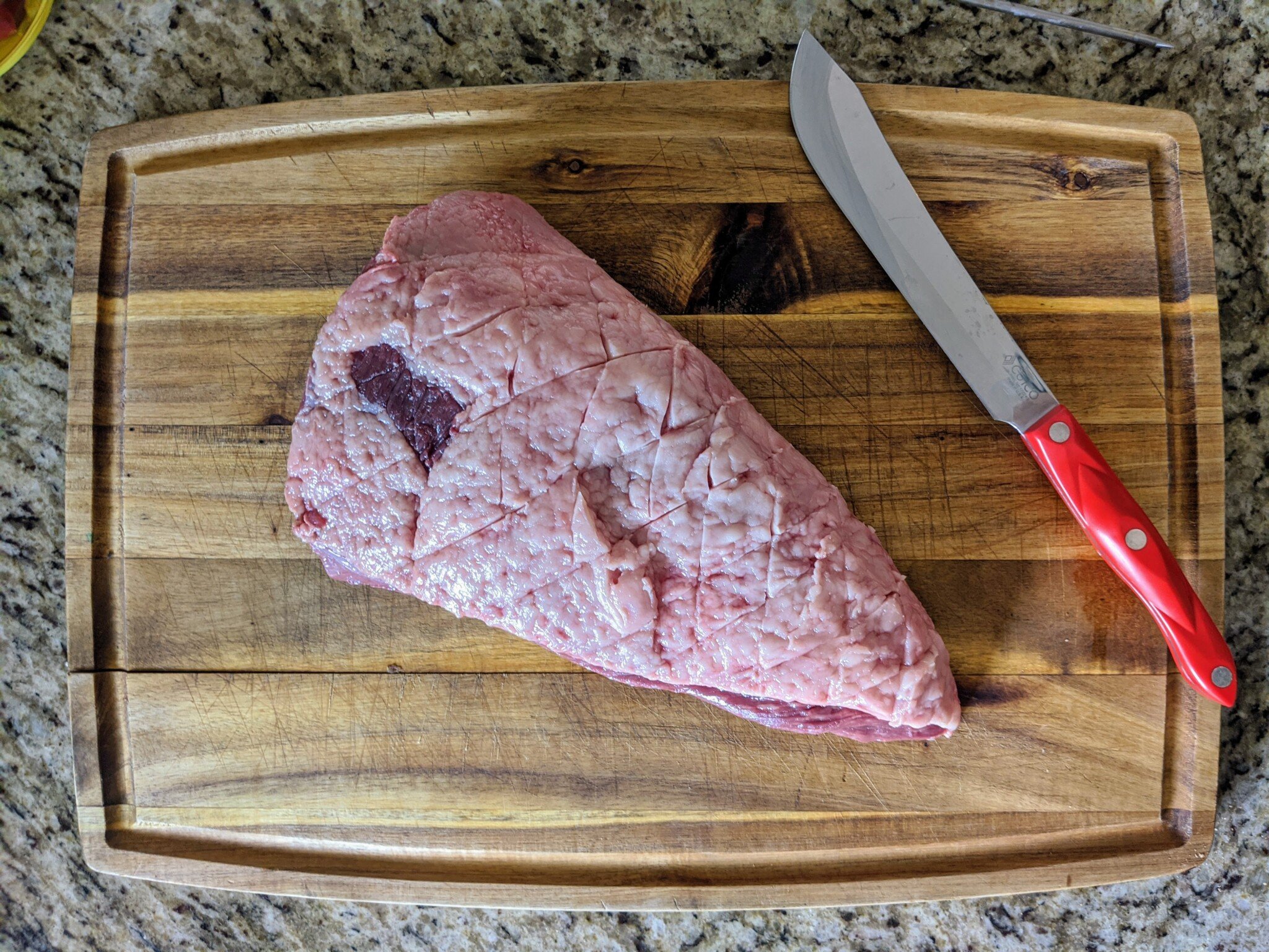 Showing the top sirloin, aka coulotte or picanha. A triangular 3 to 5 pound cut with a fat cap covering top surface.