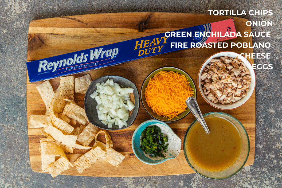 What you need to make chicken chilaquiles with salsa verde, ingredients on a wooden board