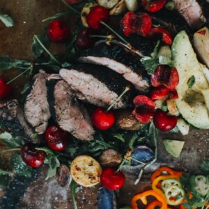 Sliced char-grilled pork tenderloin topped with stone fruit salsa