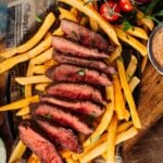 Sous Vide Flat Iron Steak sliced over frites