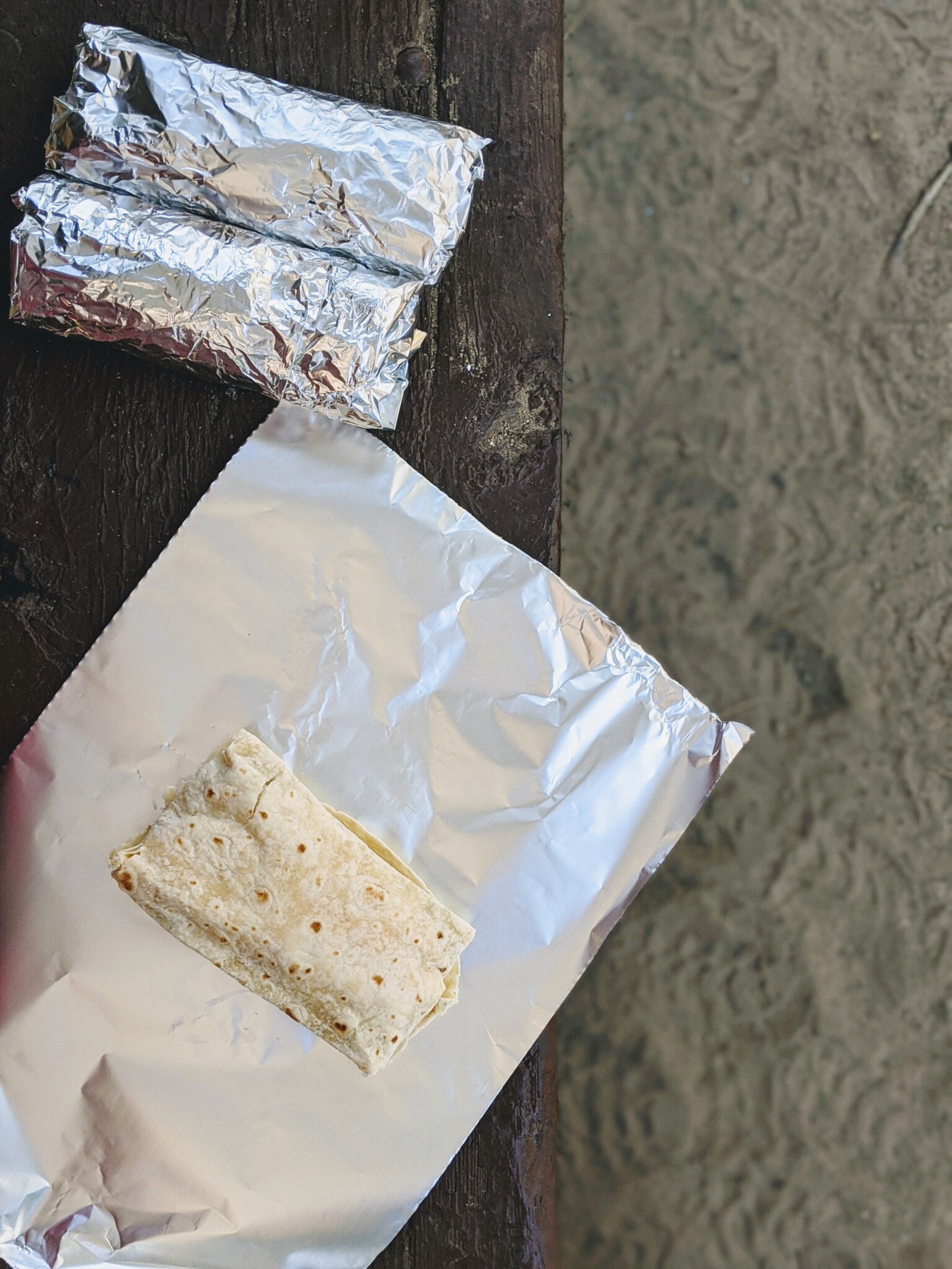 Make ahead burrito being wrapped in foil.