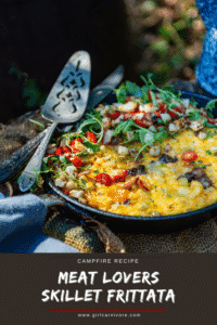 Skillet frittata loaded with meats and cheese and topped with fresh arugula and tomatoes