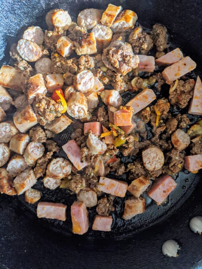 Leftover meats in a pan.