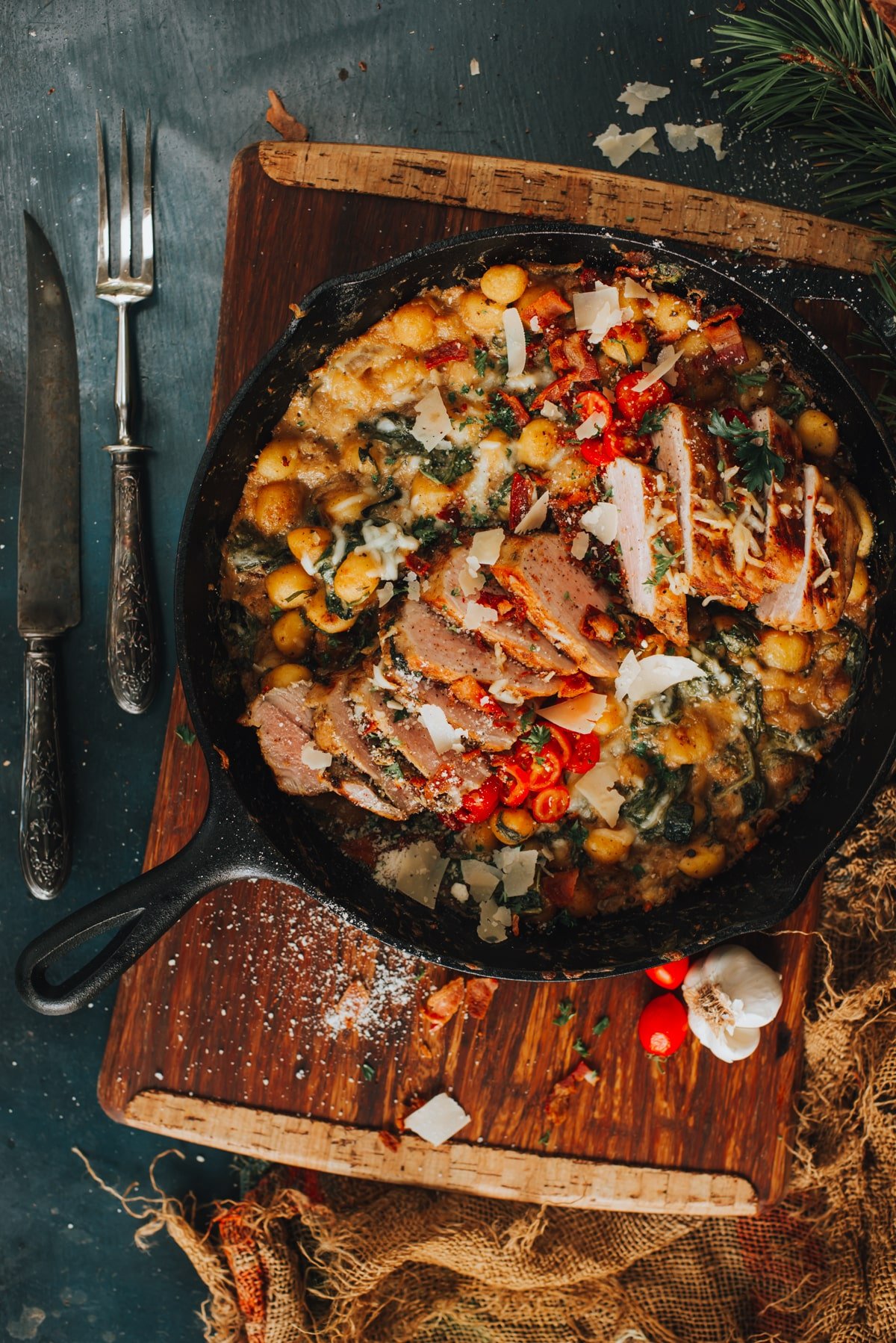 hearty pork tenderloin in cast iron skillet with cheesy gnochi