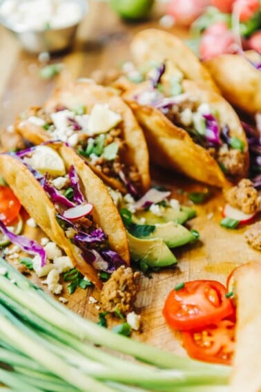 crispy fried tacos filled with ground pork and fresh veggies