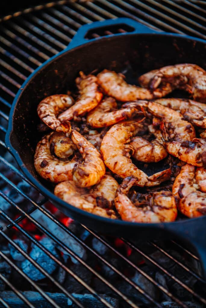 Shrimp in skillet with spices for New Orleans BBQ Shrimp on grill