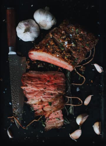 garlic, herbs, and medium rare sliced beef
