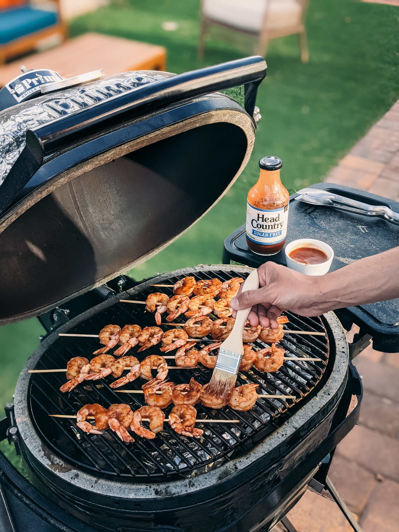 Brushing and Grilling shrimp Skewers with Head Country BBQ Sauce