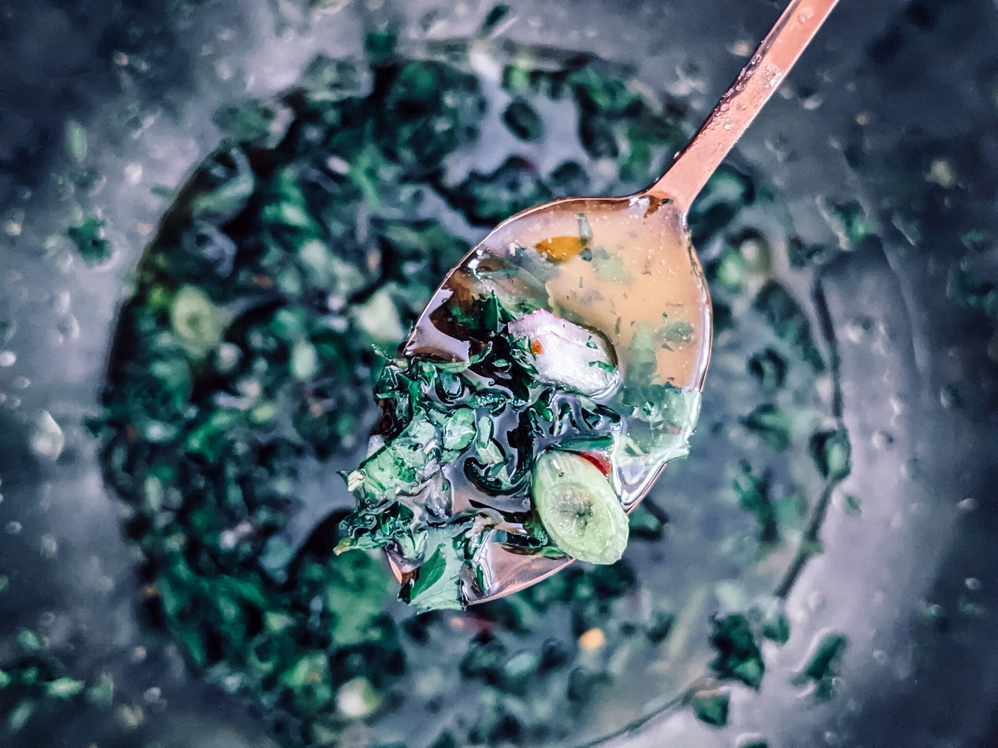 Chimichurri sauce on a spoon.