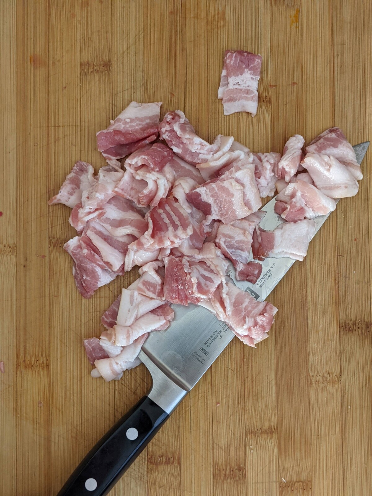 Chopped bacon on board.
