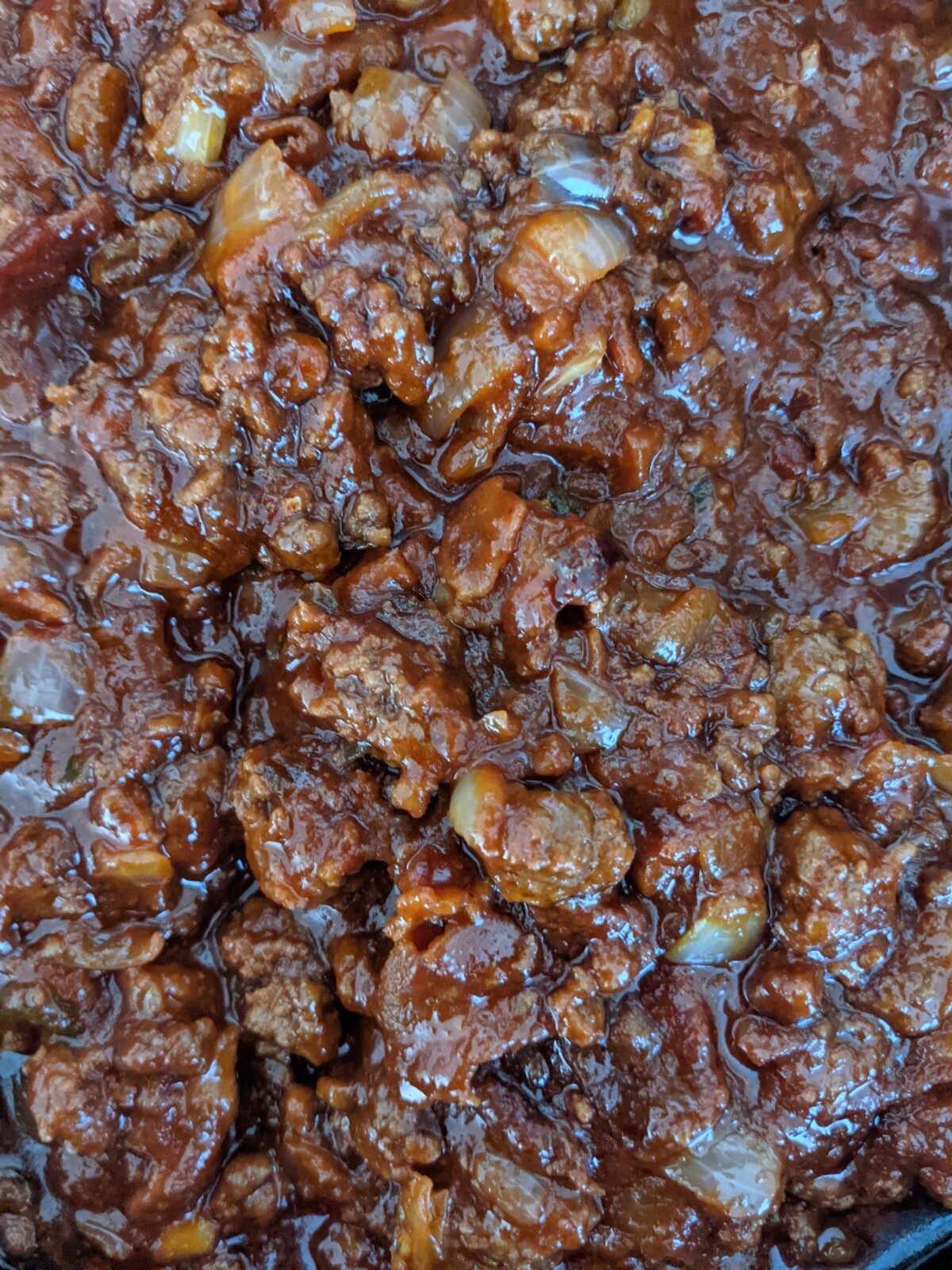 Close up of ground beef simmering for sloppy joes.