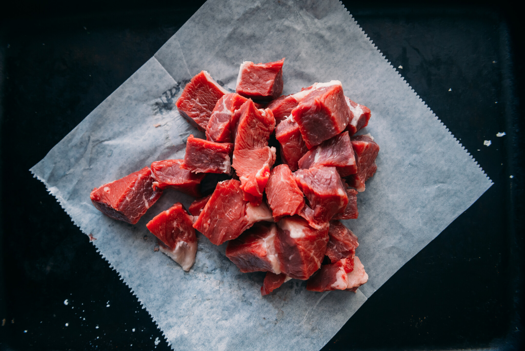 Steak cubed for kabobs.