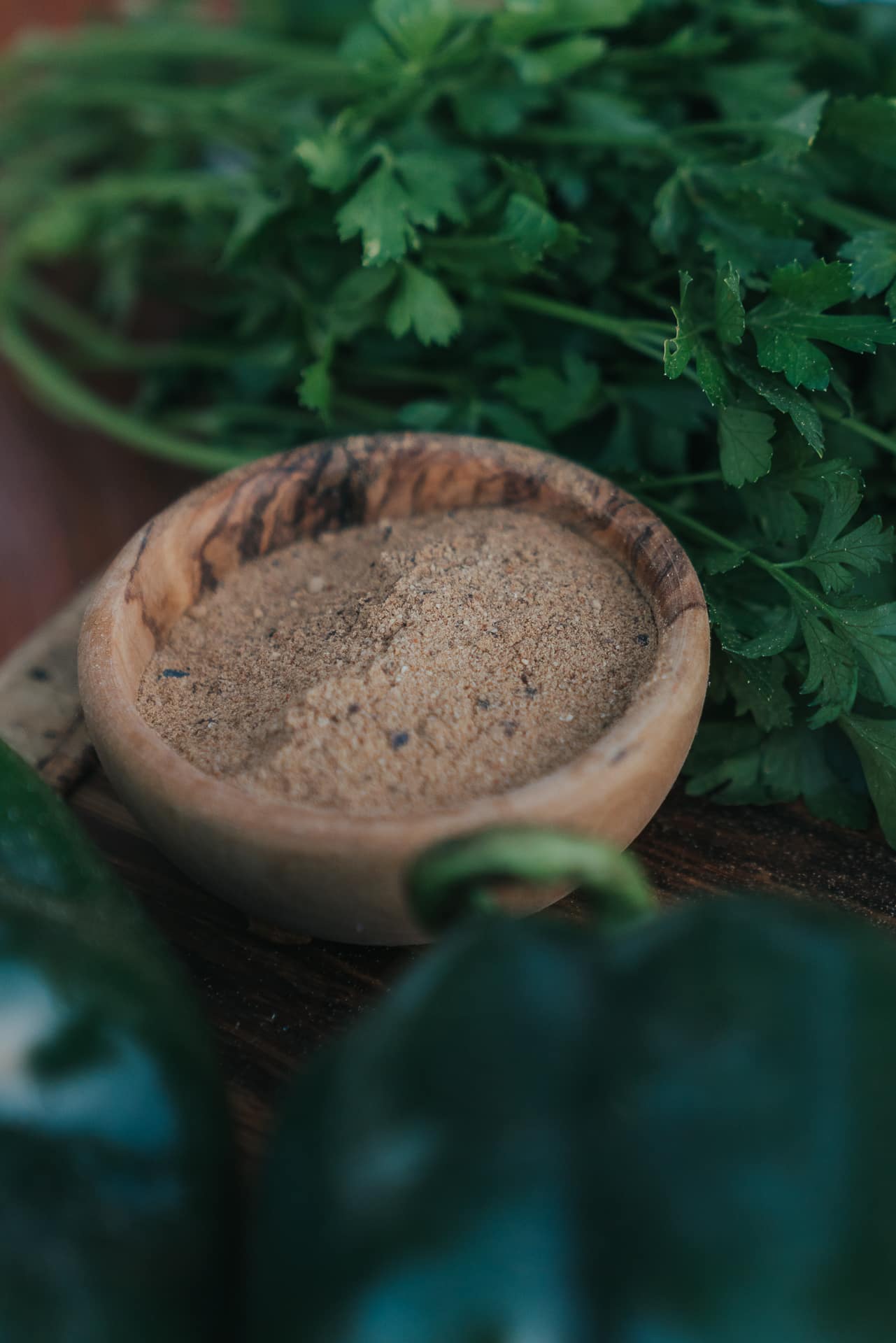 Girl Carnivore Ooomami powder in wooden bowl