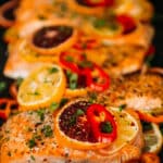 baked salmon topped with citrus and herbs