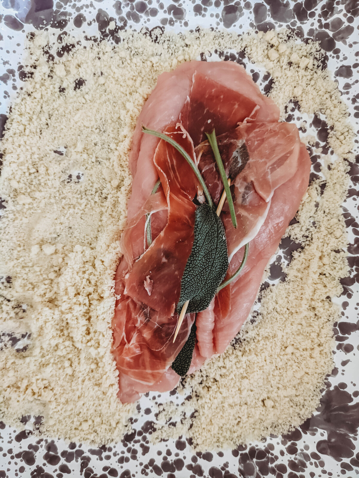 veal prepped for saltimbocca in almond flour