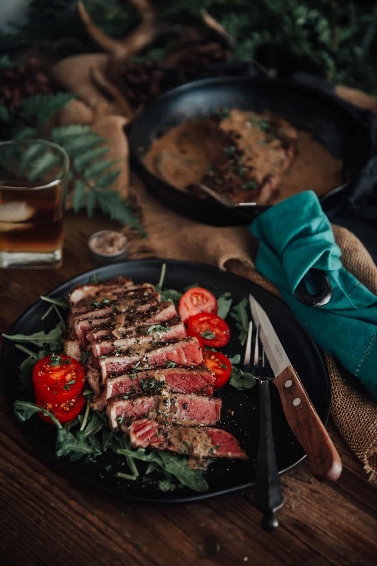 Sliced steak on a platter. 