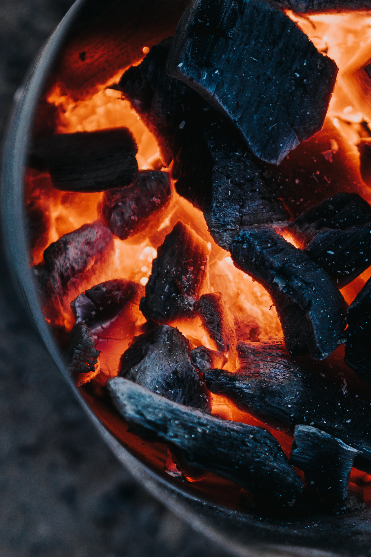 Lump charcoal in a charcoal chimney.