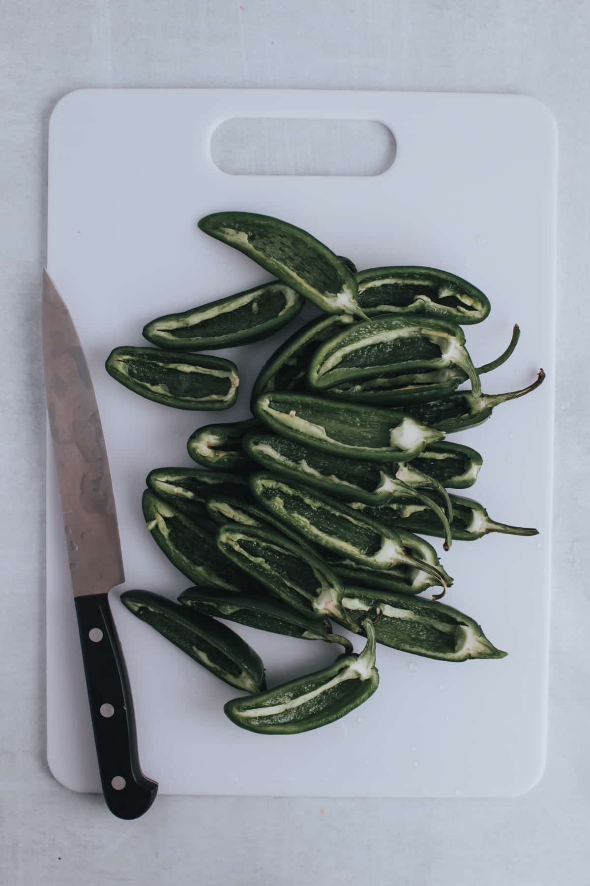 cut open jalapenos and remove seeds and stems