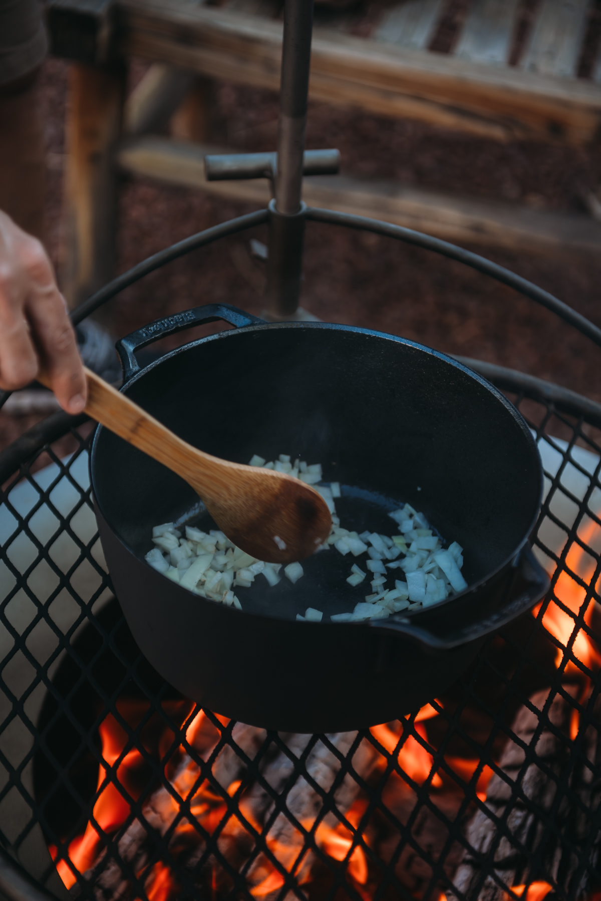 onion in dutch oven over campfire