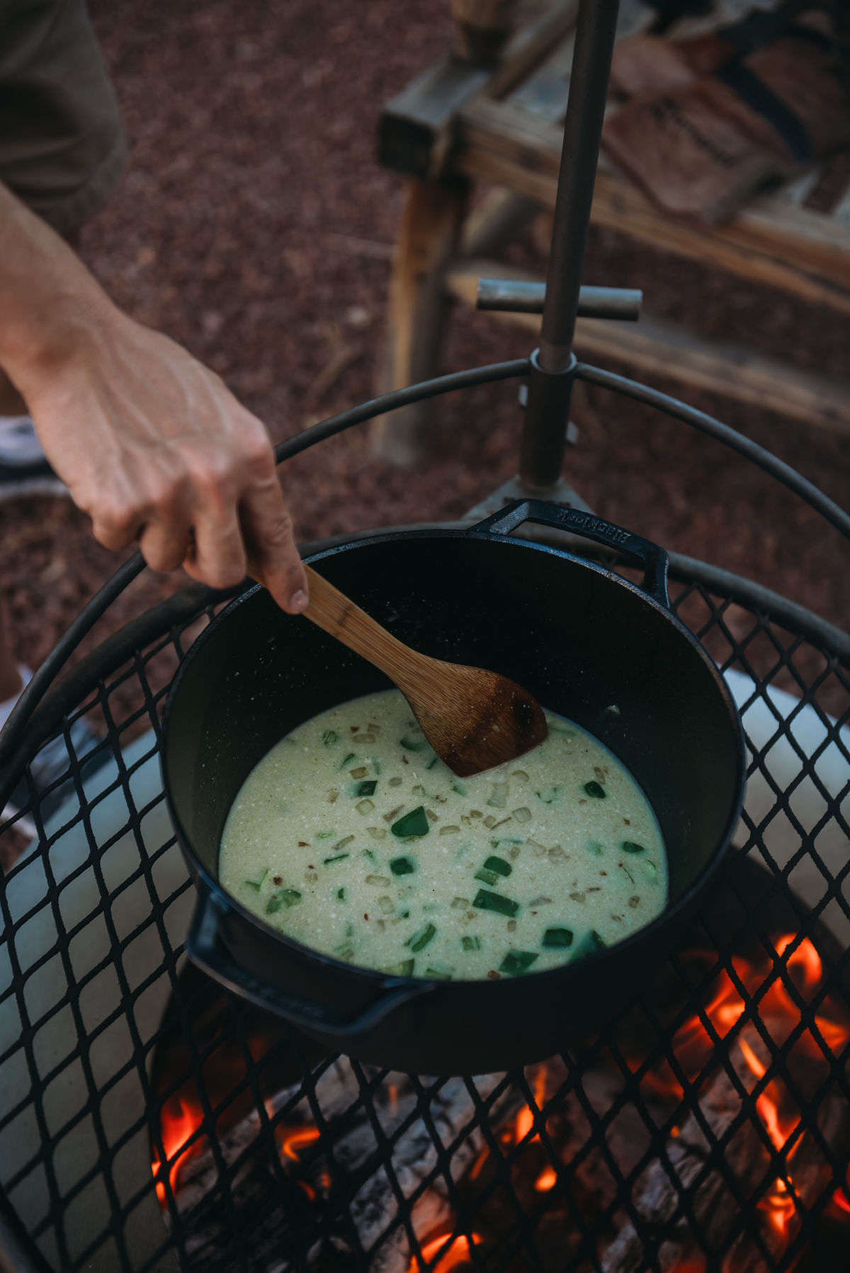 stirring in coconut milk to dutch oven