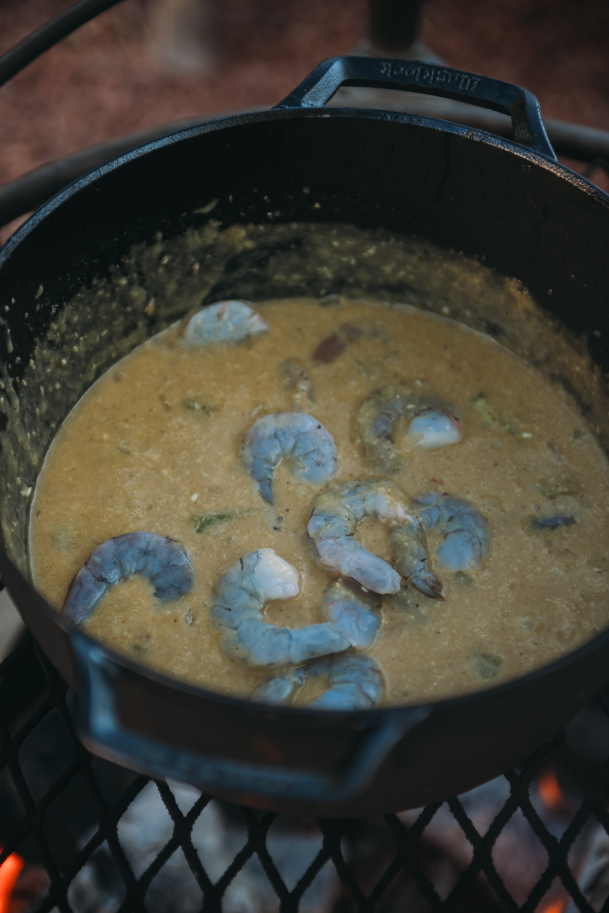 raw jumbo shrimp just added to korma curry sauce