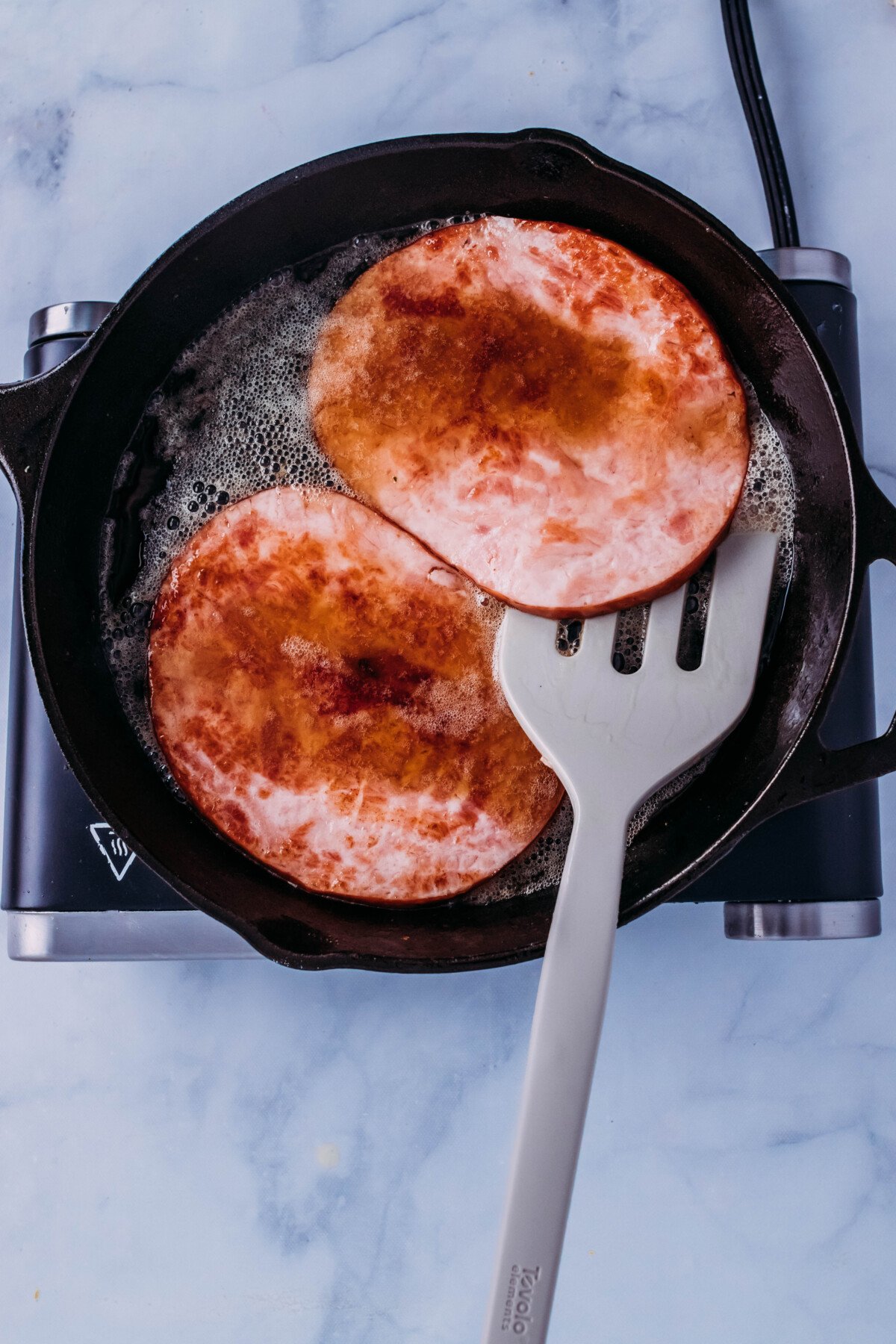 ham steaks browned in cast iron with cola sauce