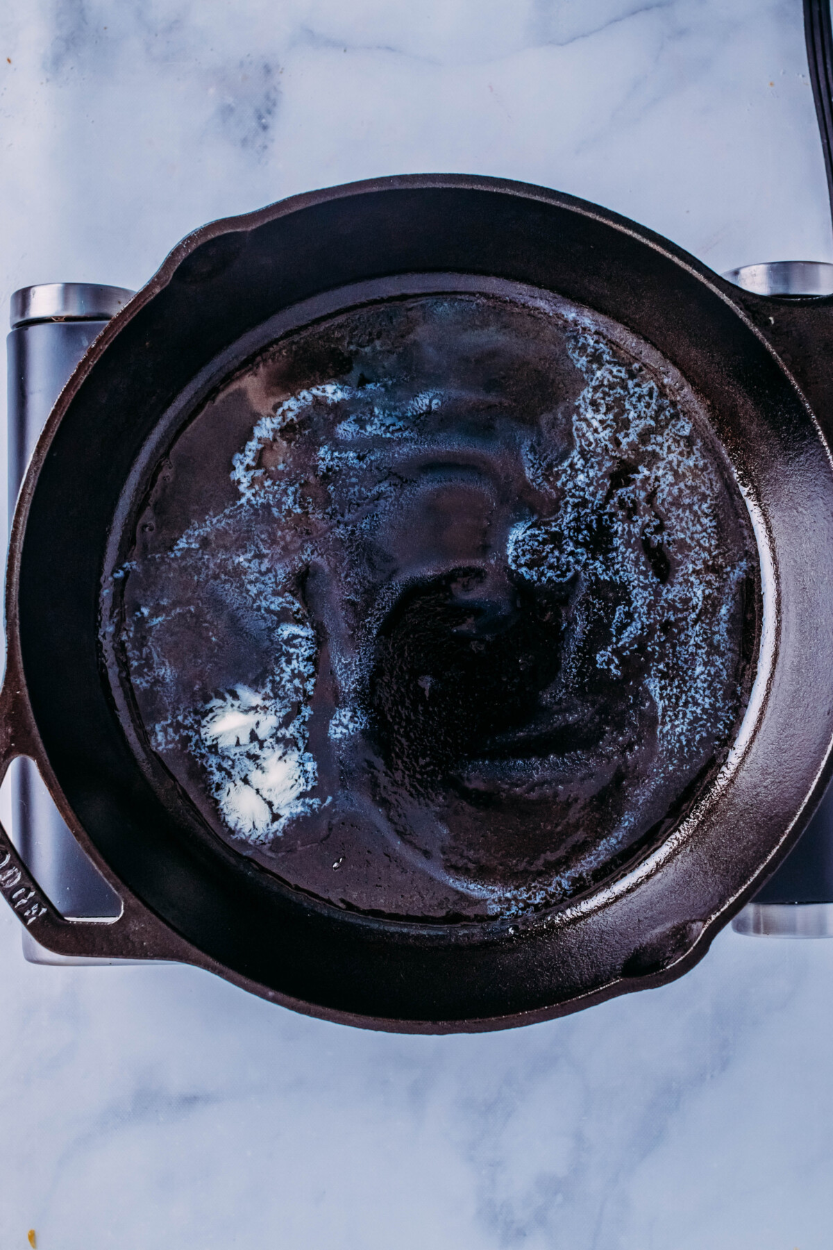 Melting butter in skillet.