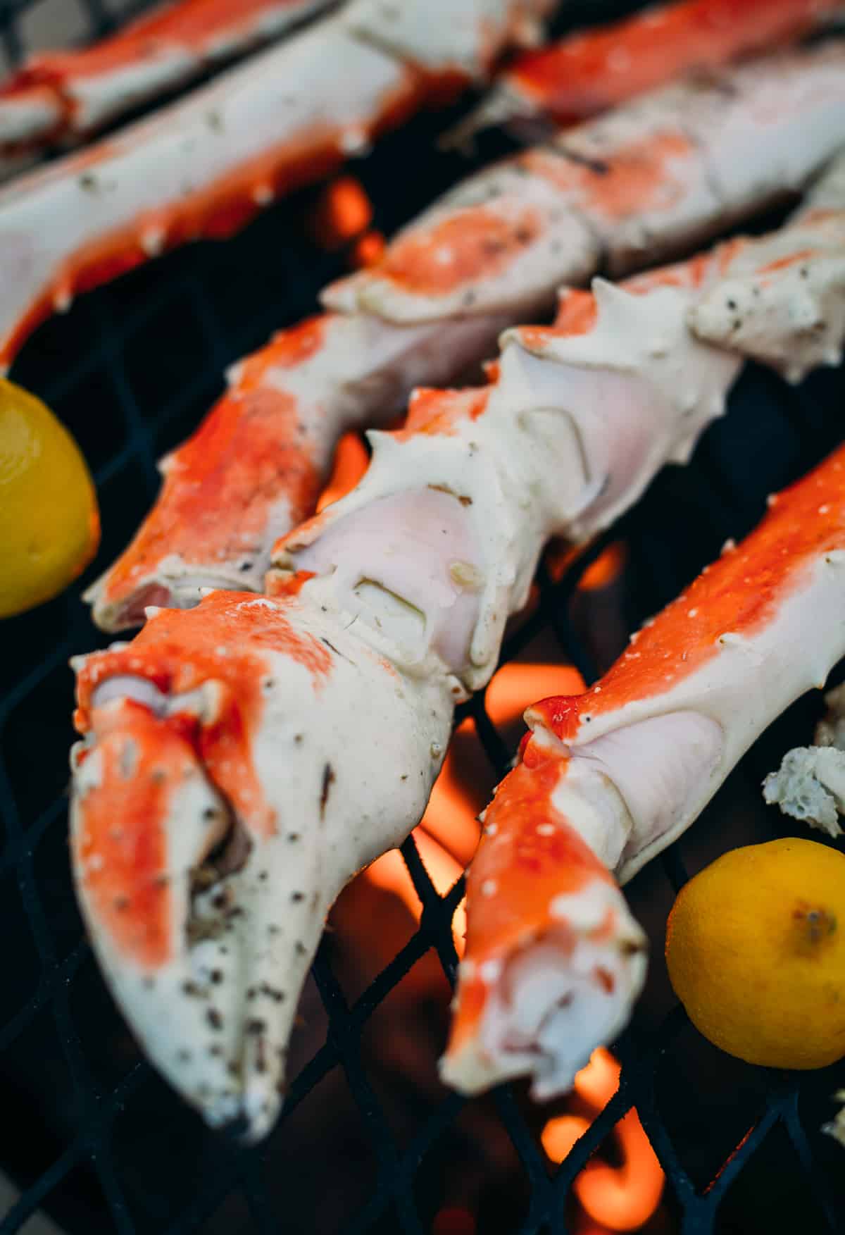 Close up of crab claw being grilled over an open fire. 