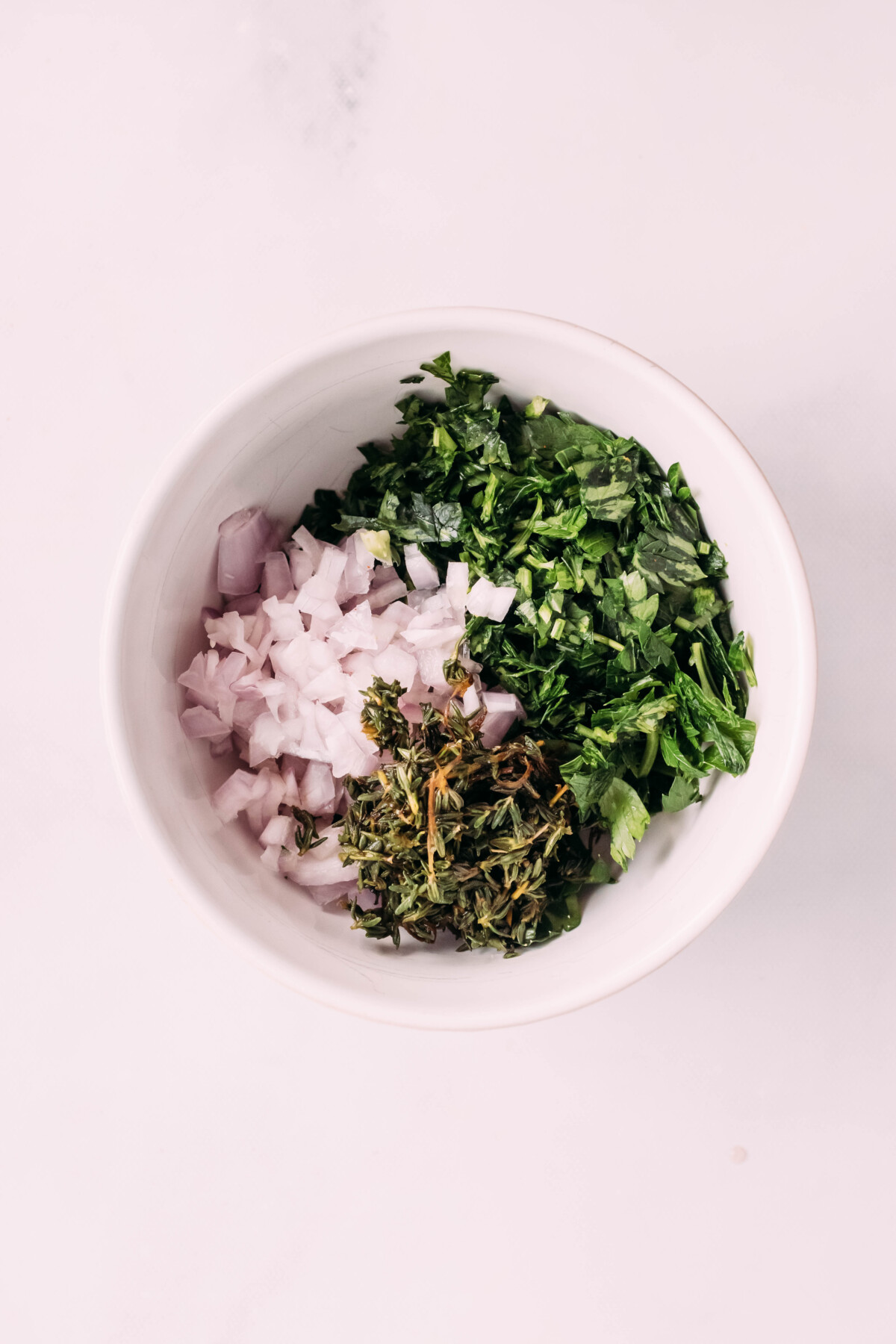 Herb paste ingredients in a bowl.