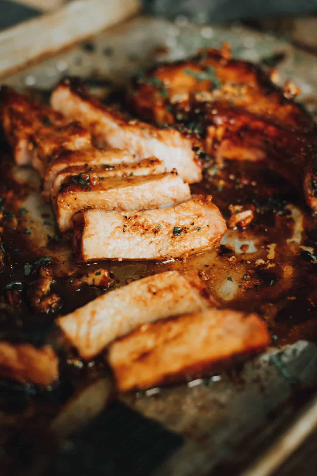 Sliced cooked pork chop to show juicy meat. 