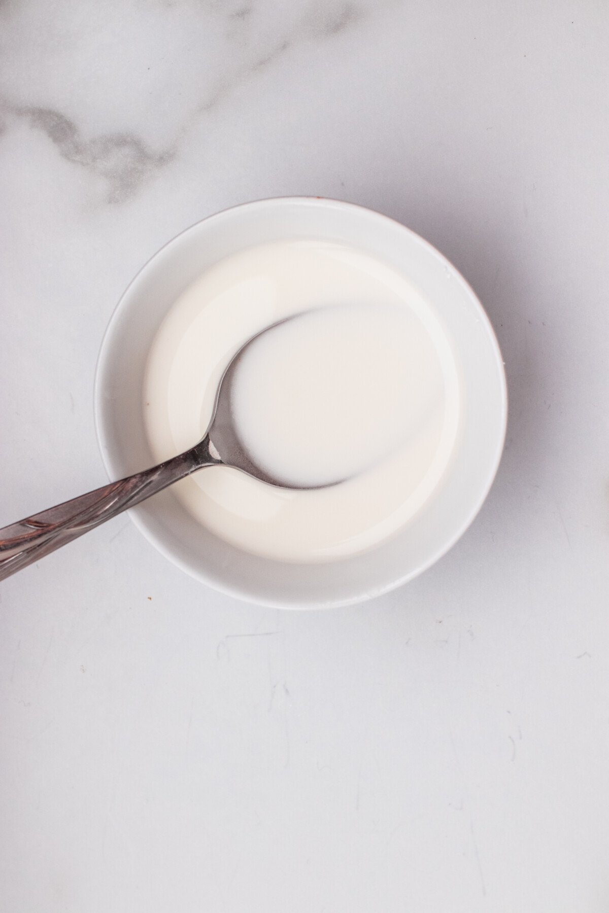 Water cornstarch slurry in a bowl. 