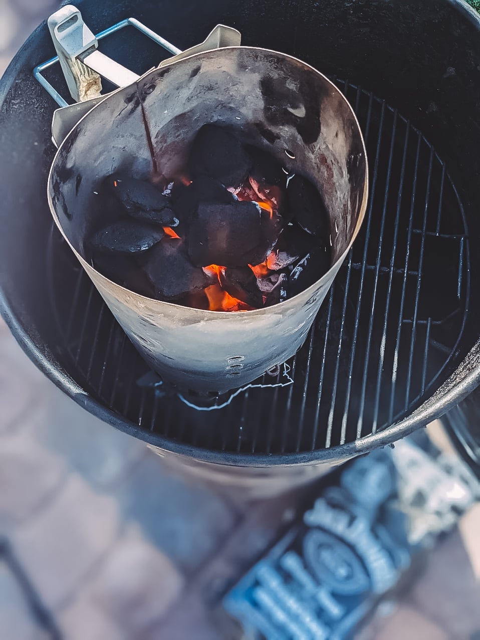 Charcoal briquets in a chimney.