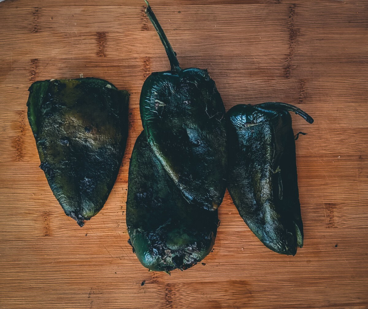 Pile of peppers showing charred skins. 