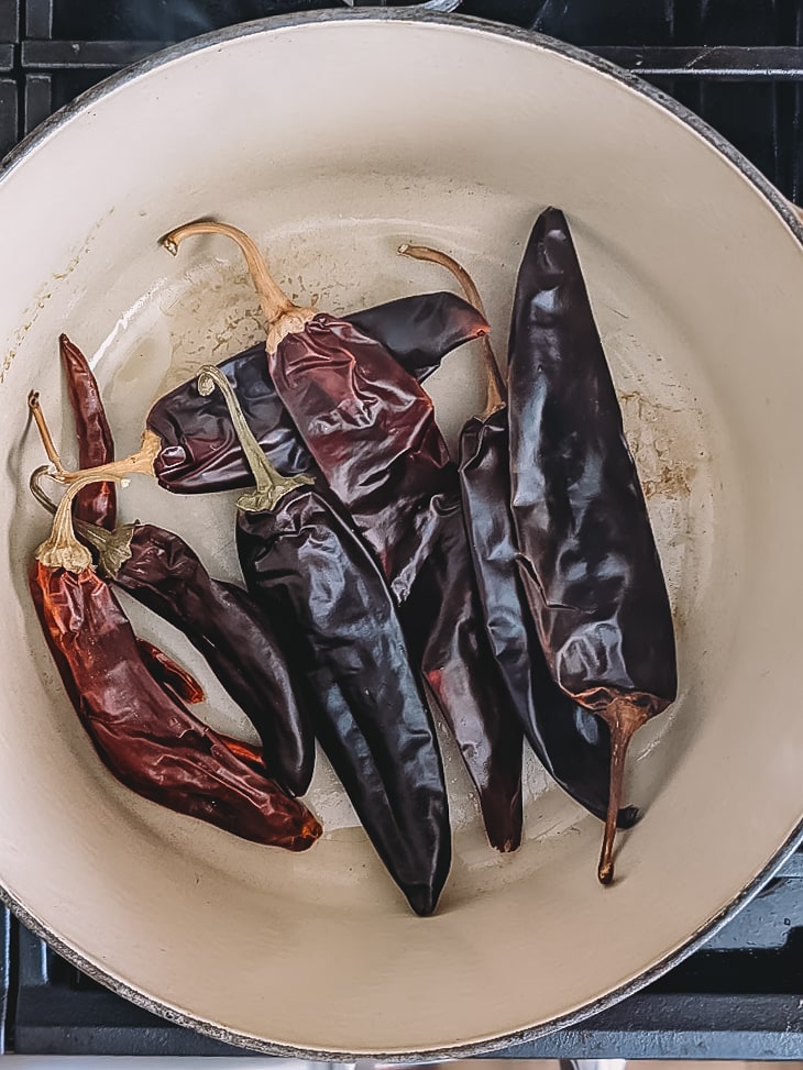 Chiles toasting in a pot. 