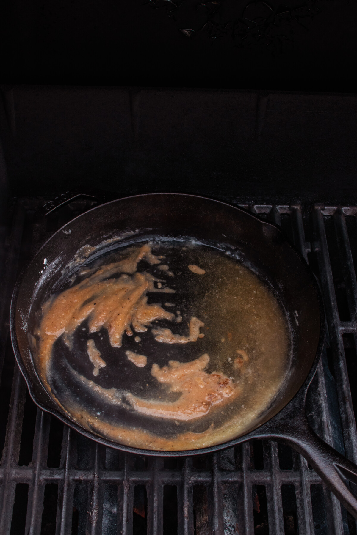 Roux forming in cast iron skillet as butter and flour cook down.