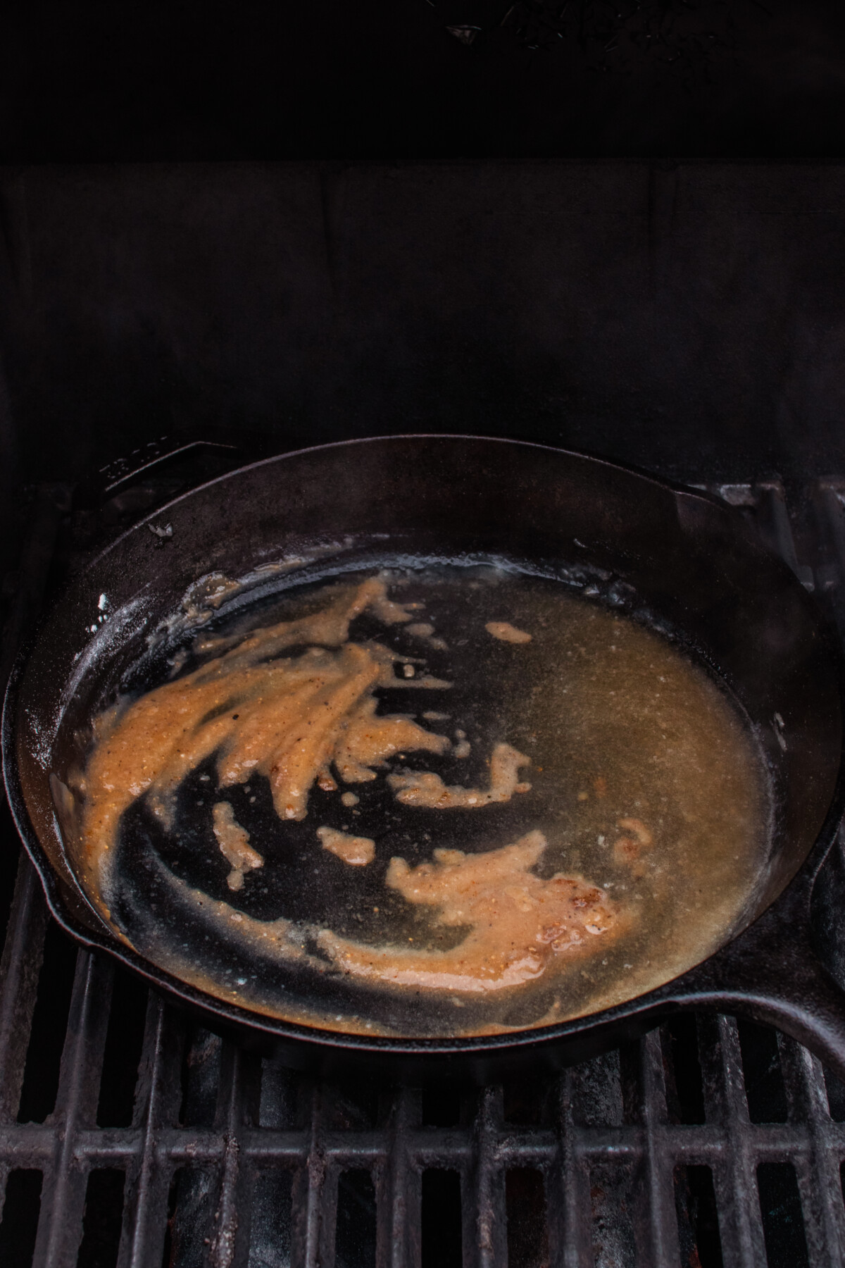 Roux forming in cast iron skillet.