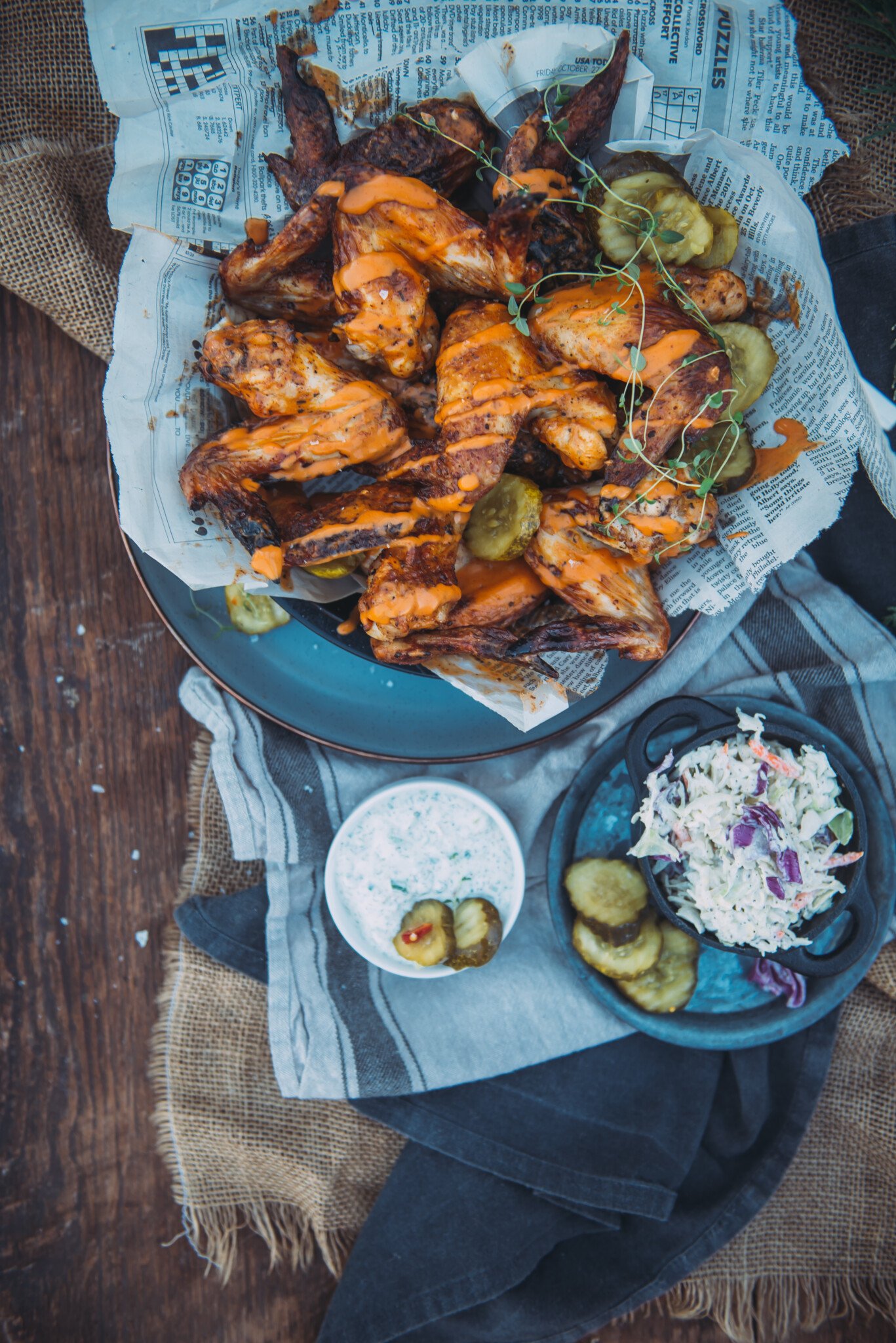 A platter of crispy chicken wings that were pickle brined and air fried before being tossed with buffalo sauce. Served with coleslaw and herb dipping sauce.