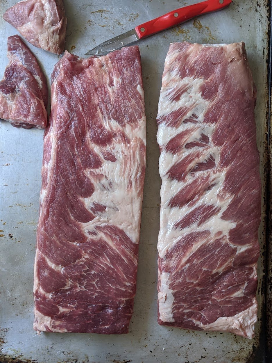 St Louis Style Ribs being trimmed. 