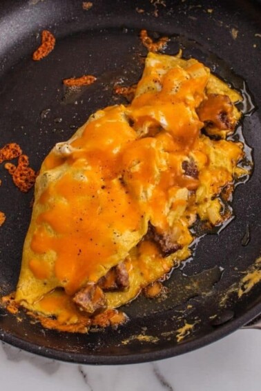 Cheeseburger Omelette on a non stick pan.