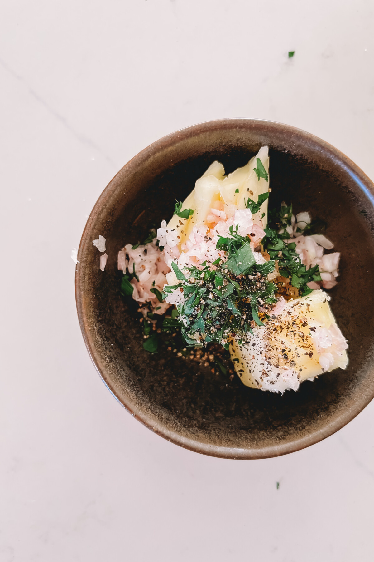 Steakhouse butter ingredients in a bowl.