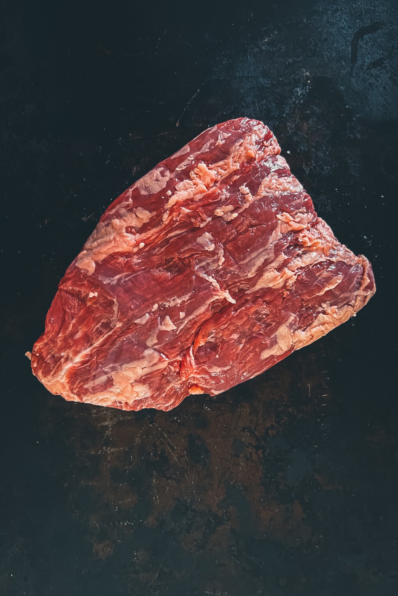 Close up of a raw bavette steak to show grain. 