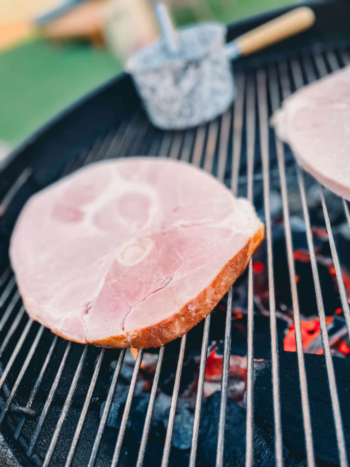 cold ham steak on a grill.