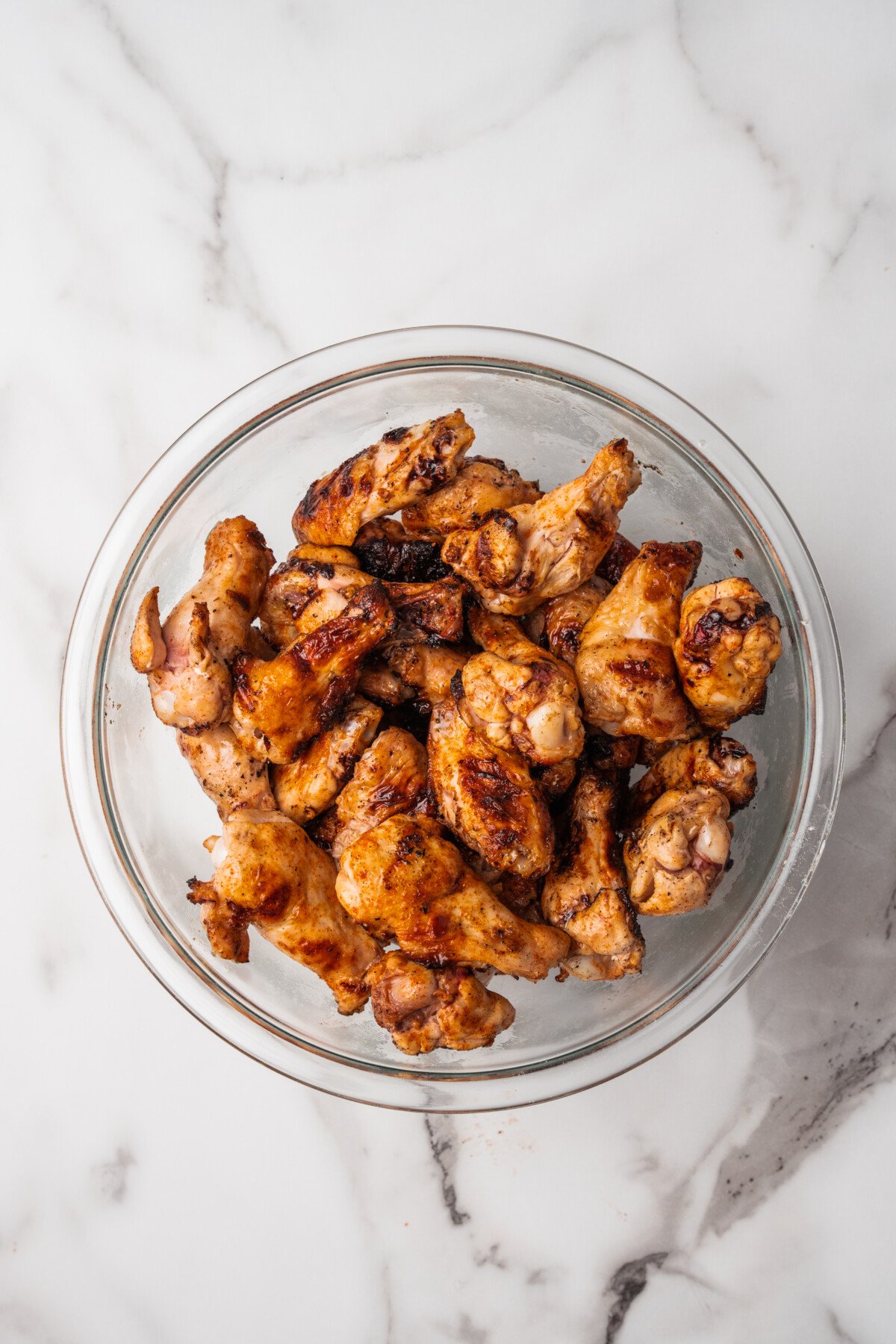Grilled chicken wings in a bowl.